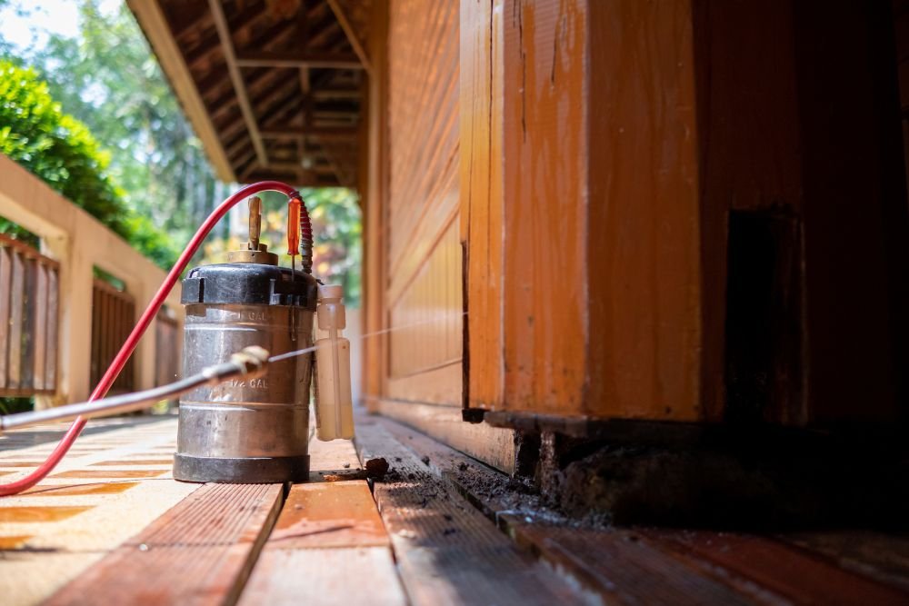 A wooden deck features a water pump, utilized by a stinging control service in San Francisco, CA.